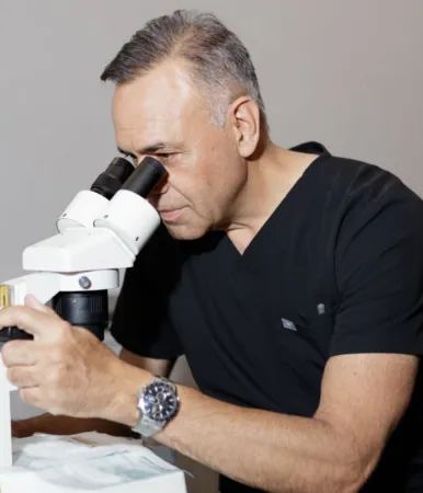 What is Dr. James Harris's role at RESTORE Hair and why is he notable?
