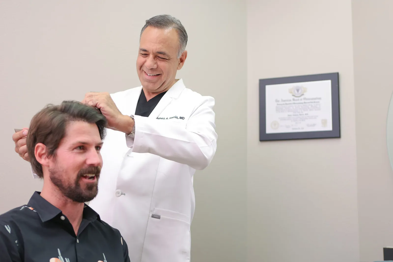 Dr. James Harris consulting with a RESTORE® patient