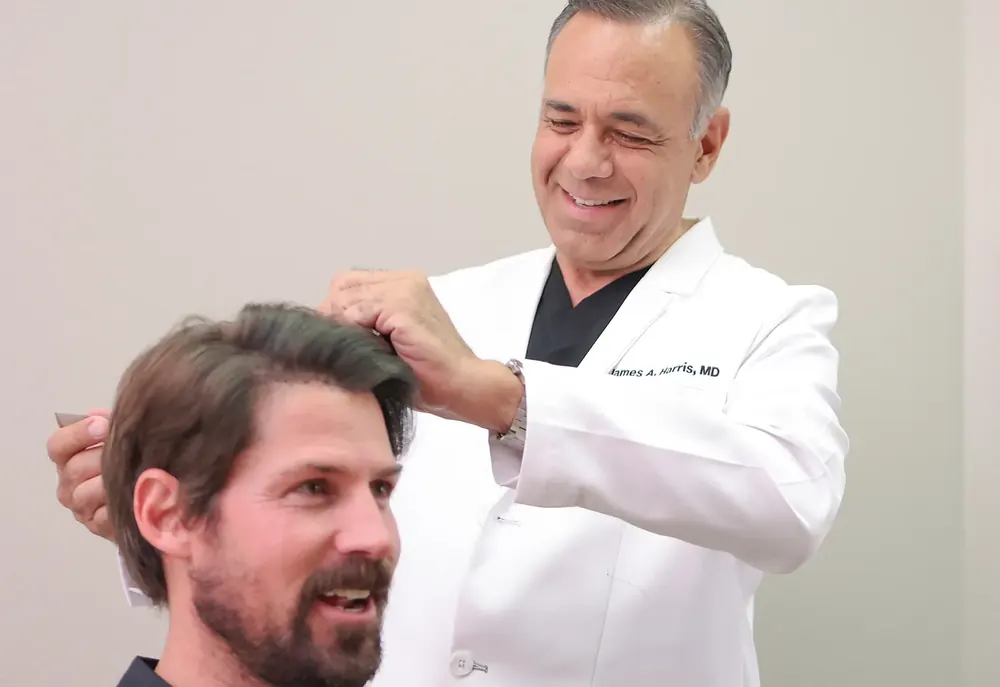 Dr. Harris consulting with a RESTORE client