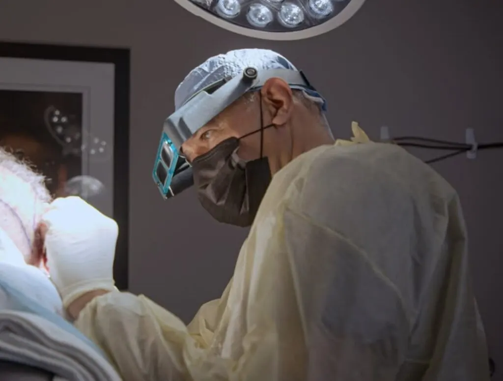 Dr. James Harris performing a RESTORE hair transplant procedure