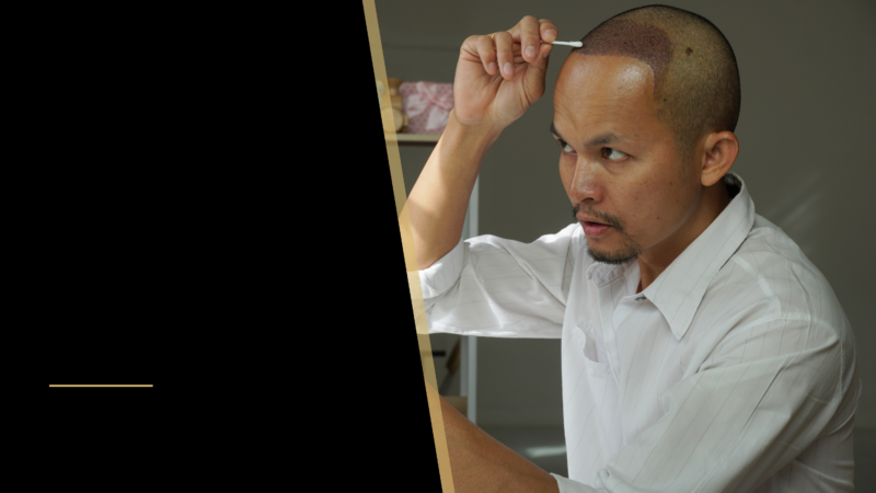 A man cleaning his scalp