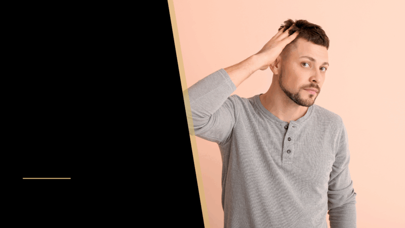 FUE vs FUT Hair Transplant | What's the Difference? 20 A man touching his hair