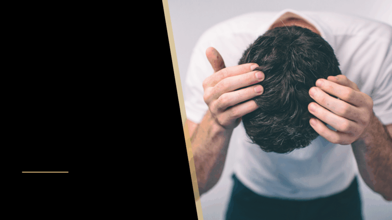 How Long Does it Take for a Hair Transplant to Grow? Hair Growth Timeline 6 A man touching his hair