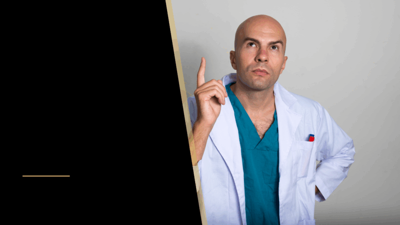 A bald man pointing his finger